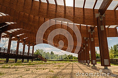 Massive wood beams roof structure mounted with metal shape connectors and screws, nuts and bolts. Stock Photo