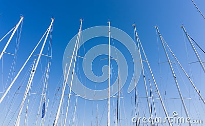 Mast against a blue sky, ship mast, marina in European city, the Editorial Stock Photo