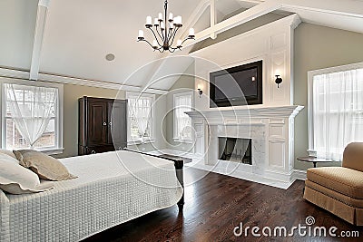 Master bedroom with marble fireplace Stock Photo