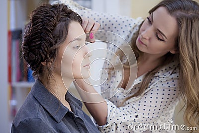 Master brow makes the procedure of courting eyebrows. Stock Photo