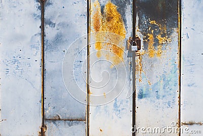 Master door stainless steel lock and master key at the old rusted Stock Photo