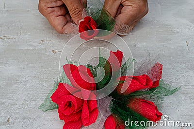 Artificial flowers from bright red paper and fabric Stock Photo