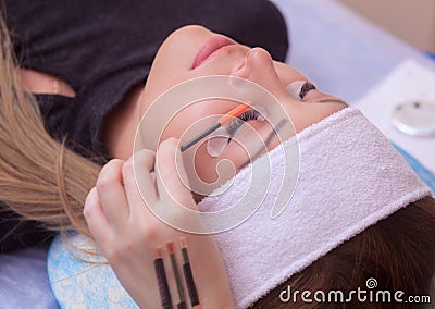 Master makeup corrects, combs, a comb for the eyebrows, extended eyelashes Stock Photo