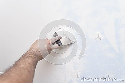 The master plasters the wall. copy space. Stock Photo