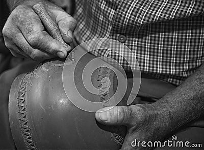 master potter while modeling Vadastra Ceramica clay vessels Stock Photo