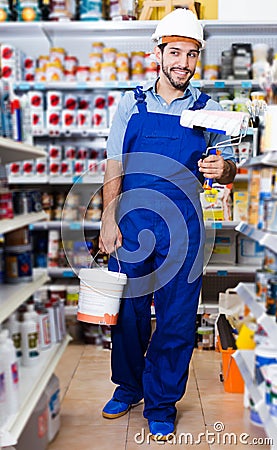master standing with rollers and paint Stock Photo