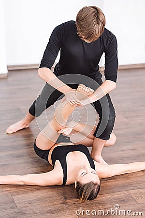 Masterful good looking woman exercising on the floor Stock Photo