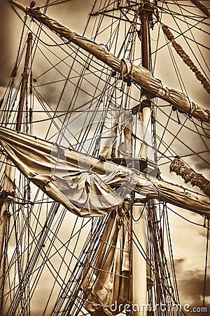 Masts and sails of an ancient sailing ship Stock Photo