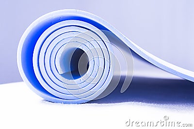 Mat for practicing yoga, pilates and stretching exercises Stock Photo