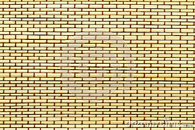 Mat from yellow wood bamboo sticks with brown thread Stock Photo