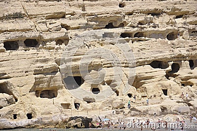 Matala, september 4th: Cave on the rocks on the famous hippies Matala beach on Crete island Editorial Stock Photo