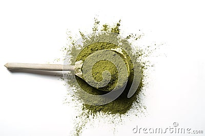 Matcha green powder in wooden spoon isolated on white background Stock Photo