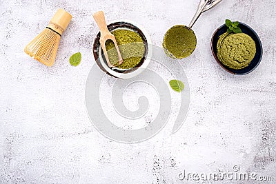 Matcha green tea ice cream with waffle cone and mint leaves setup on white stone background . Summer and Sweet menu concept Stock Photo