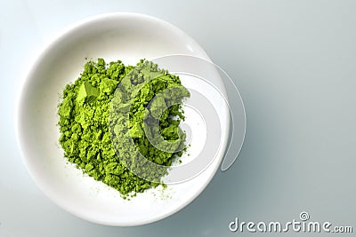 Matcha powder in white bowl Stock Photo