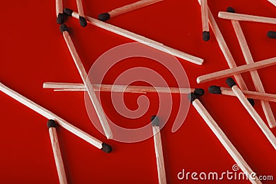 Matches on a red background, an abstraction about teamwork and modern relationships Stock Photo