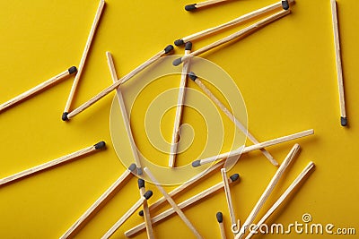 Matches on a yellow background, an abstraction about teamwork and modern relationships Stock Photo