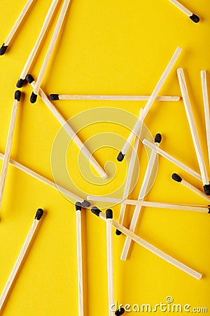 Matches on a yellow background, an abstraction about teamwork and modern relationships Stock Photo