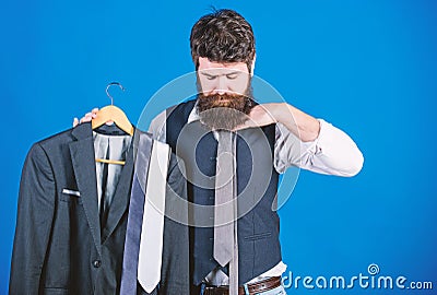 Matching necktie outfit. Man bearded hipster hold neckties and formal suit. Perfect necktie. Shopping concept. Stylist Stock Photo