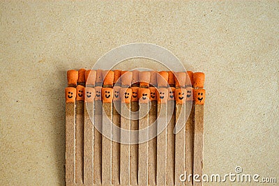 Matchsticks with faces painted on the heads on old paper Stock Photo