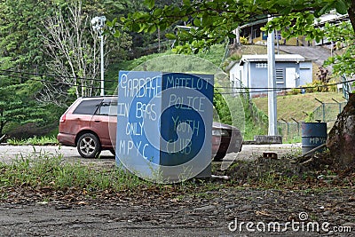 A Big, Blue Garbage Bin Disposal in Matelot, Trinidad and Tobago West Indies Editorial Stock Photo