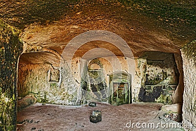 Matera, Basilicata, Italy: interior of an old cave house carved into the tufa rock in the old town Sassi di Matera Editorial Stock Photo