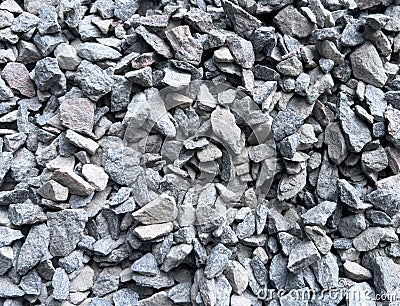 Material coral stone for the road foundation layer. Closeup of a pile of crushed stone texture background. Coarse gravel stone Stock Photo