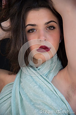 Young blonde girl with long straight hair and pashmina covering Stock Photo