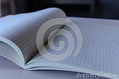 math grid box graphing paper open book engineering closeup macro background Stock Photo