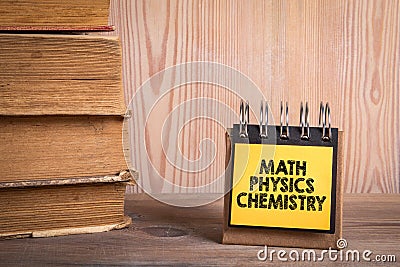 Math Physics Chemistry. Stack of books and a notebook on a shelf Stock Photo