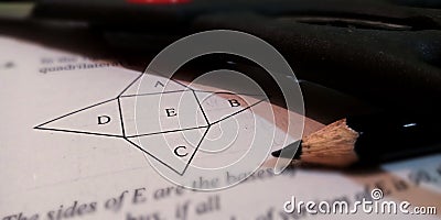 mathematical diagram on geometric patterns presented on white paper with pencil pointer Stock Photo