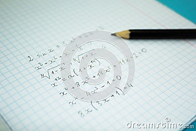 Mathematical examples and calculations in a notebook for lectures Stock Photo