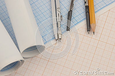Mathematical instruments over the corner of a math graph paper with copy space for text. Math graphic tools concept Stock Photo