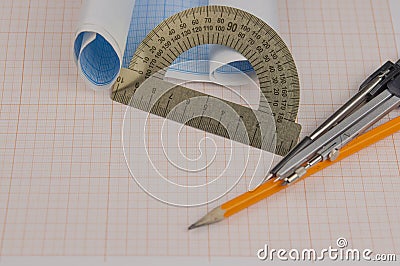 Mathematical instruments over the corner of a math graph paper with copy space for text. Math graphic tools concept Stock Photo