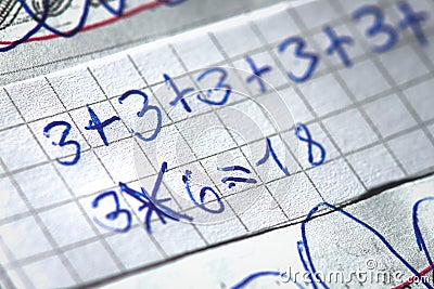 Mathematical operations at school written by a child Stock Photo