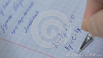 Mathematics, Equations close-up. Homework. Solving Mathematical Problem. Student solves the equation on paper Stock Photo