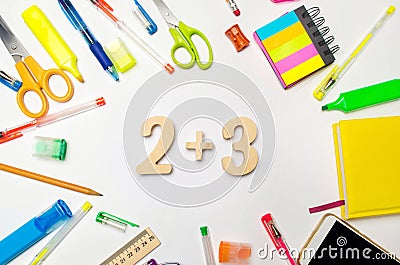 Mathematics. numbers 2 plus 3 on the school desk. concept of education. back to school. stationery. White background. stickers, co Stock Photo
