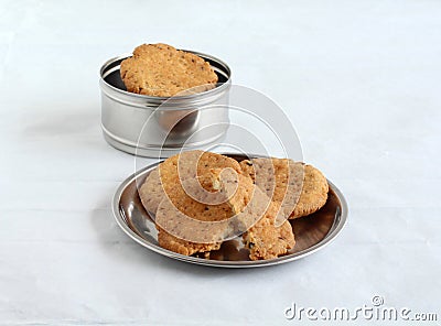 Mathri Indian Vegetarian Snack on a Steel Plate Stock Photo