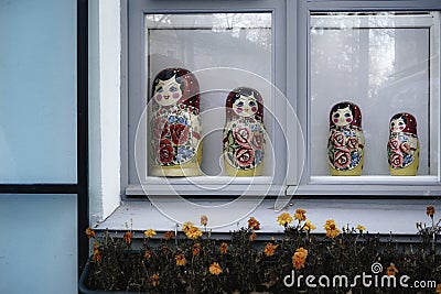 toys window flowers matryoshka creation multicolors Stock Photo