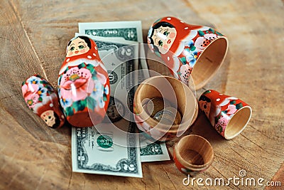 Matryoshka. Russian doll with dollars. Anti crisis money box. Stock Photo