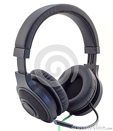 Matt black headphones with a headset with a green wire cuted isolated Stock Photo