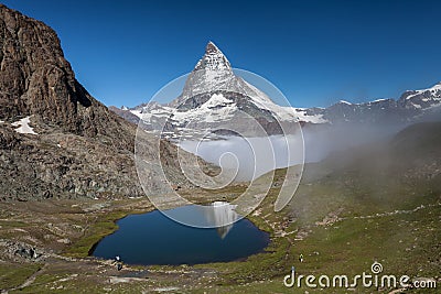 Matterhorn and Rillelsee lake , Swiss Alps Stock Photo