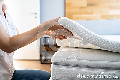 Mattress Topper Being Laid On Top Stock Photo