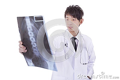 Mature asia male radiologist studying patient's x-ray Stock Photo