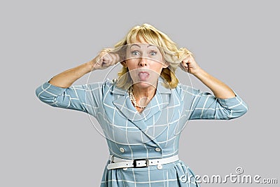 Mature attractive woman making grimace. Stock Photo