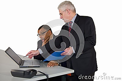Mature businessman being instructed by his boss Stock Photo