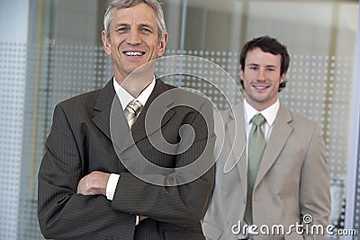 Mature businessman with collea Stock Photo