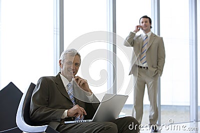 Mature businessman seated Stock Photo