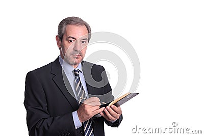 Mature businessman taking notes Stock Photo