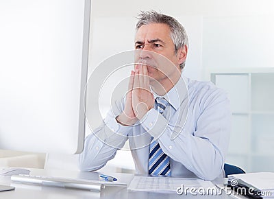 Mature businessman thinking Stock Photo