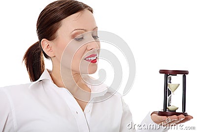 Mature businesswoman with hourglass Stock Photo